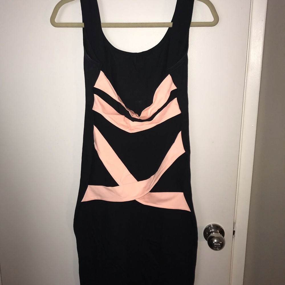Black open back midi dress with pink detailing!